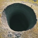 Nothing to see here, just a massive crater in the middle of Siberia after methane probably made it collapse or explode.